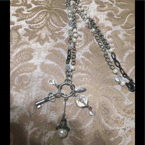 Plunder 28”long silver pendant w/ multiple charms